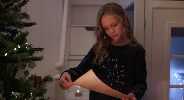 Girl reading a scroll with myopia