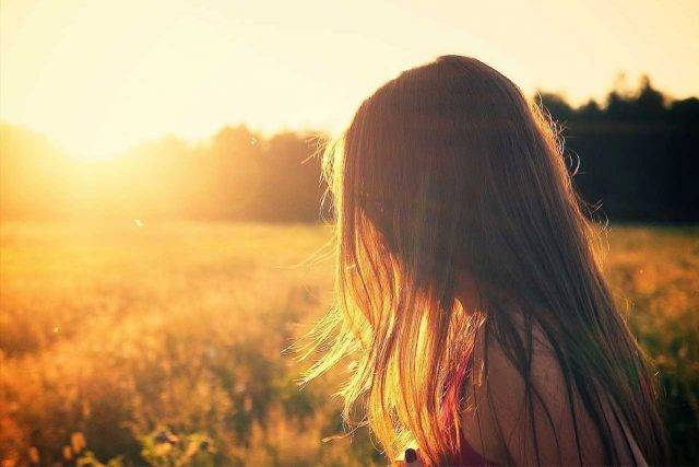 woman looking at the sun